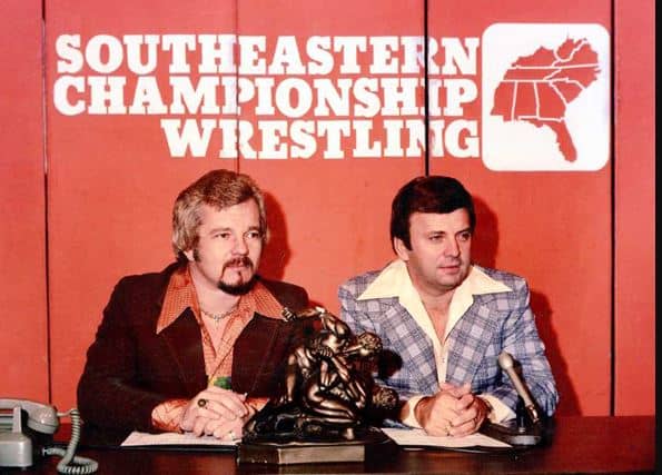 Les Thatcher and unidentified mc'ing Southeastern Championship Wrestling