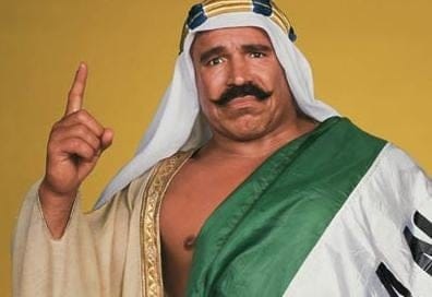 7 Wrestling Stories Exposing Life on the Road The Iron Sheik in costume showing he's #1 with his pointer finger
