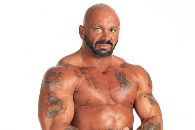 Perry Saturn posting with muscles and tats during his wrestling days