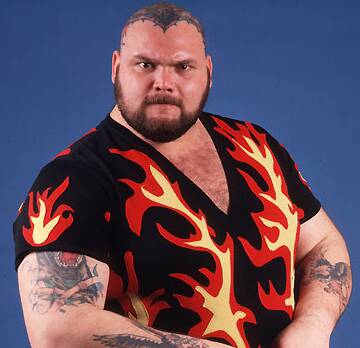 Bam Bam Bigelow promo shot in a tshirt with red and yellow flames