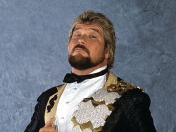 Randy Savage and Jake Roberts Infamous Snake Bite Incident Ted Dibiase in his tuxedo with gold and dollar sign lapels