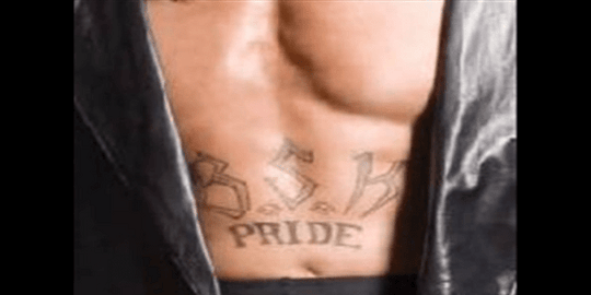 Undertaker's 'Bone Street Krew Pride' tattoo on his stomach.
