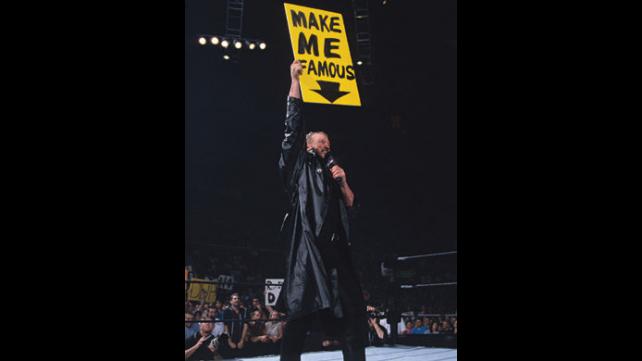 The Debut of DDP was one of the loudest debuts you'll ever see in the WWE. Witness Diamond Dallas Page Rip off his mask and see what he reveals! DDP dressed in all black with a leather trench coat holding a yellow sign above his head that says, "Make Me Famous"