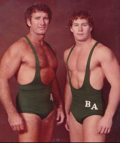 Bob and Brad Armstrong in green wrestling slings who held the Southeastern Wrestling tag team titles