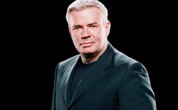Head shot of Eric Bischoff in a black suit and tshirt