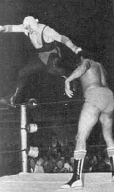 Old school, back when it was the new school. Don Jardine was the first big man to make walking the ropes a standard part of his matches. When the Undertaker does it, it's an homage to the man who trained him, The Spoiler Old school The Spoiler Don Jardine walking the ropes a standard part of his matches.