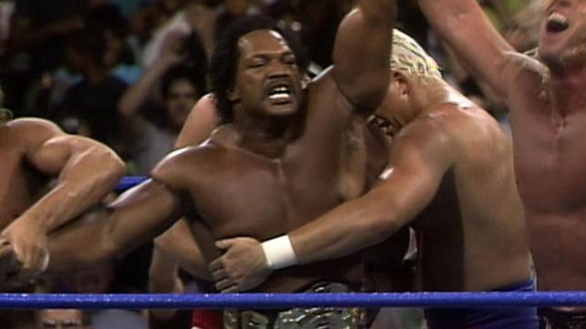 Ron Simmons with his arms up in victory captured the WCW title at a house show in Baltimore, Maryland, in August 1992.