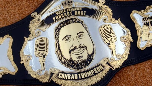 With such a glut of options when it comes to professional wrestling podcasts, there is one whose in front of the rest, Conrad Thompson - read our interview. Wrestling Title Belt image World Class Host Conrad Thompson on it and 2 microphones