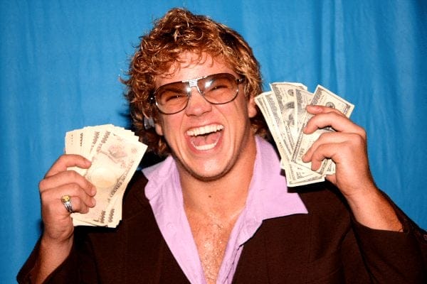 'Sweet and Sour' Larry Sweeney holding up wads of cash and smiling big