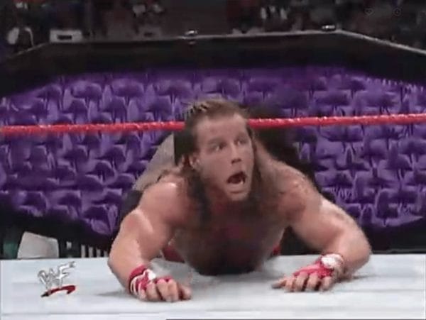 Shawn Michaels attempting to escape the grasp of the Undertaker at 1998's Royal Rumble