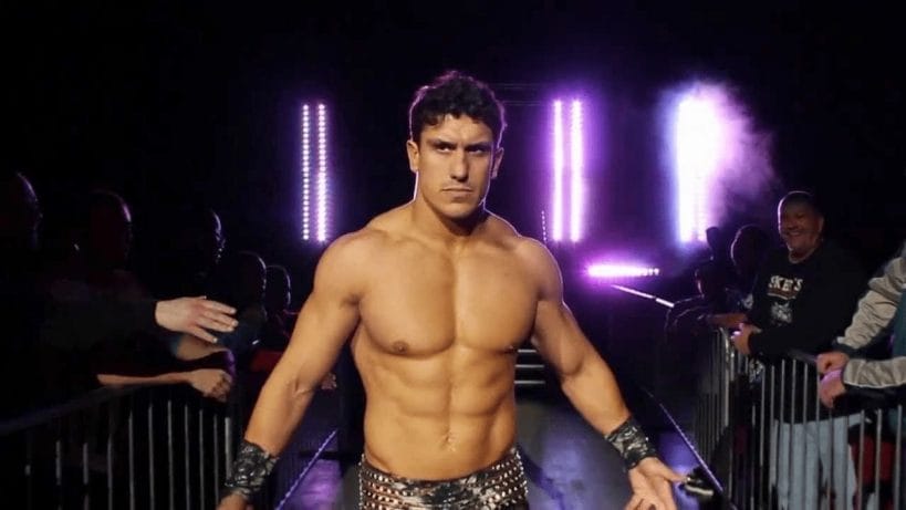 EC3 entering to his wrestling music, "Trouble" in black leather studded pans and concentration on his face