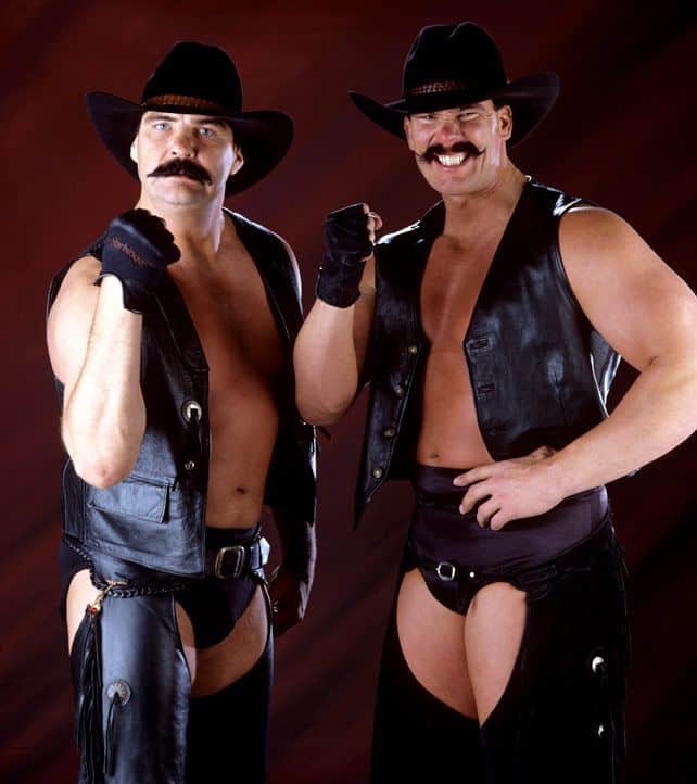 Tag Team The Blackjacks (as the 'New Blackjacks' with Barry Windham and Justin Bradshaw with big 70's mustaches black leather vests and chaps over their wrestling trunks)