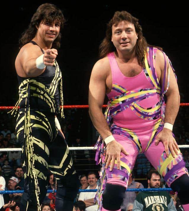Tag Team The New Rockers (Marty Jannetty and Al Snow aka Leif Cassidy) playing up to the camera in the ring in neon wrestling singlets