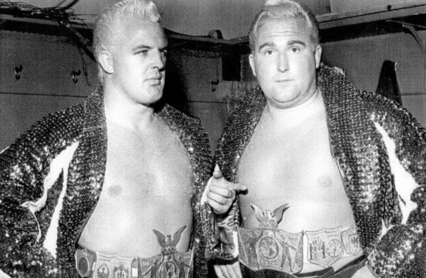 Eddie (left) and Dr. Jerry Graham in their heyday with blond hair wearing sequined jackets and title belts