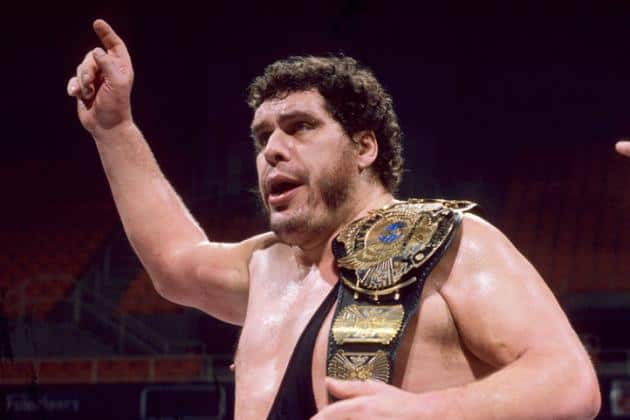 Andre the Giant documentary - Andre with his right hand up in the air with the winged eagle WWF world championship belt thrown over his left shoulder