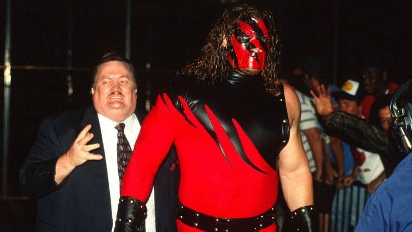 Kane - 20 Iconic (and Rare!) Attires Worn Over The Years A masked Kane debuts with Paul Bearer by his side