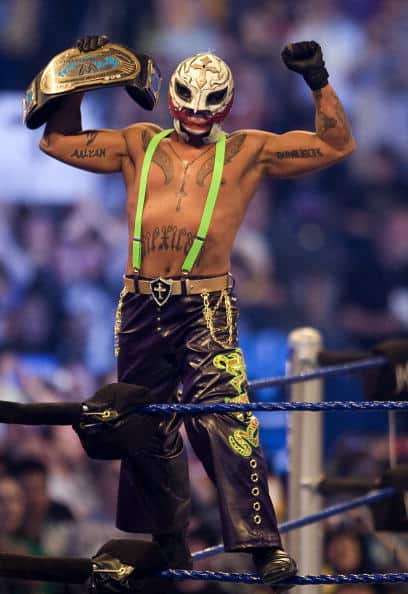 In-ring, Rey Mysterio, as The Joker, took off the wig and coat to reveal bright green suspenders and even died green hair slightly visible from the back. WrestleMania 25