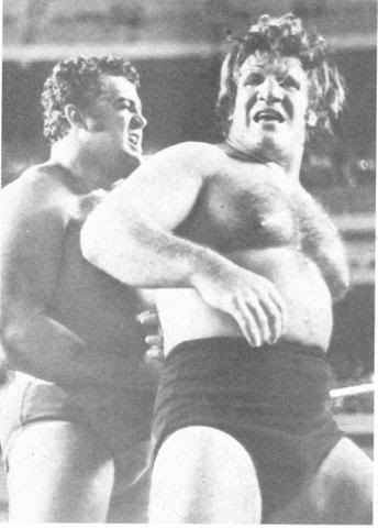 A black and white photo of Pedro Morales and Bruno Sammartino in the ring.