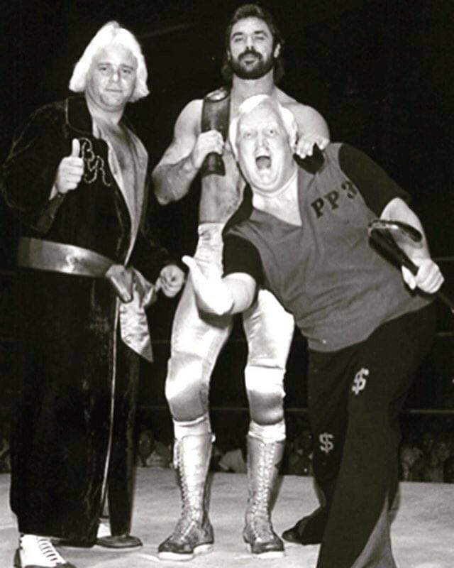 Buddy Rose, Rick Rude and Percy Pringle III (Paul Bearer) in Championship Wrestling from Florida in 1985.