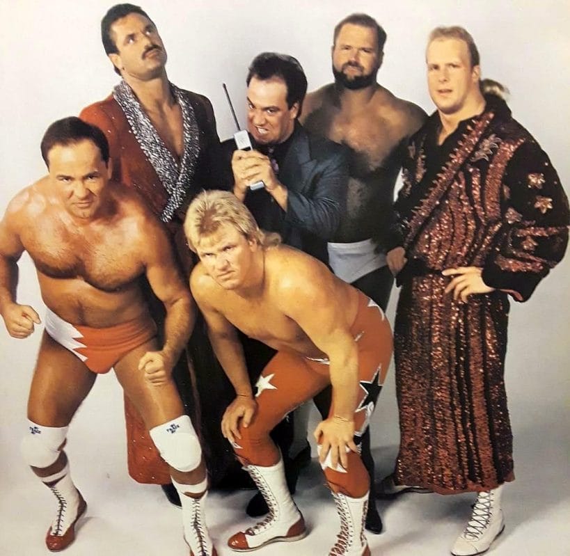The Dangerous Alliance - Larry Zbyszko, Rick Rude, Bobby Eaton, Paul E. Dangerously (Paul Heyman), Arn Anderson, and Stunning Steve Austin