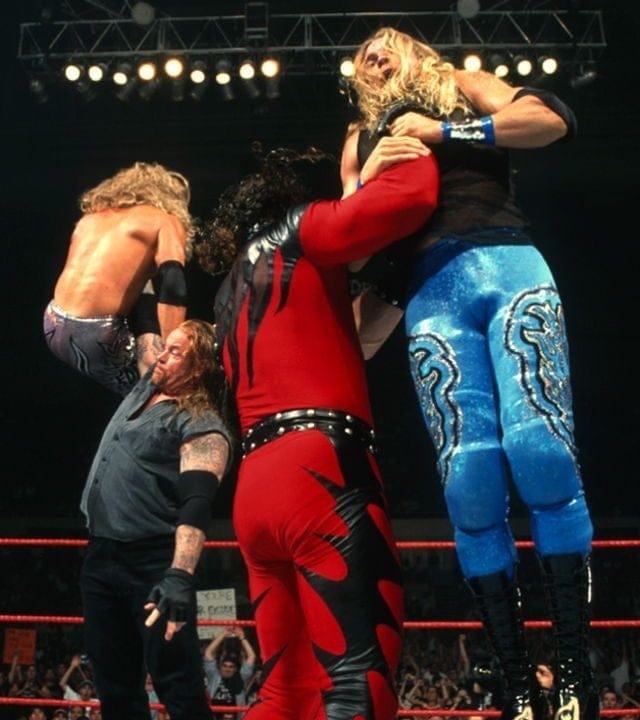 Undertaker and Kane choke-slamming Edge and Christian to Hell!