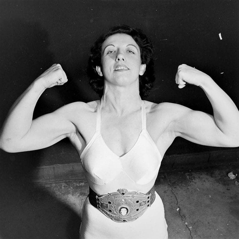 After defeating Clara Mortensen, the nearly two-decade championship run for the legendary Mildred Burke was only just beginning. Here, she poses with her Midwest Wrestling Association Welterweight Championship belt.