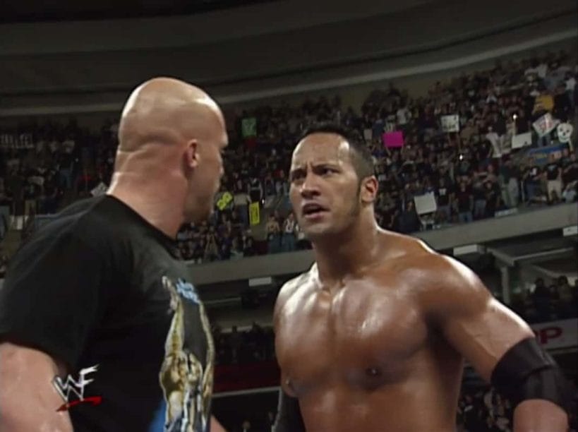 Looking angry, The Rock and Stone Cold stick to the storyline in the ring.