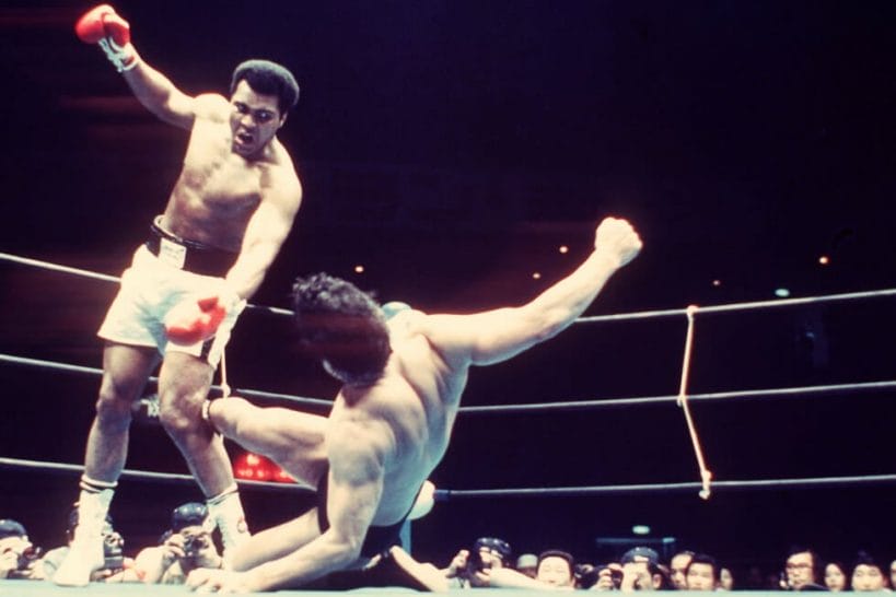 Antonio Inoki sends kicks in the direction of Muhammad Ali from the ground during their boxer vs. wrestler bout that took place on June 26, 1976, at the Nippon Budokan, Tokyo, Japan.