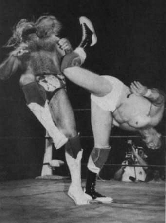 Chris Adams leveling Michael PS Hayes with the Superkick.