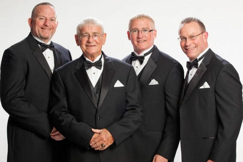 Bullet Bob Armstrong alongside his sons "Road Dogg" Brian James, Scott Armstrong, and Steve Armstrong at the WWE Hall of Fame in 2011.