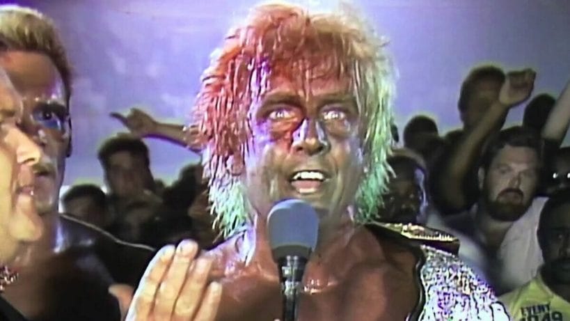 Ric Flair bleeding from a Terry Funk branding iron and recovering from Great Muta's green mist spray at WCW Great